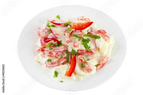 salad with potato, pepper, mayonnaise on the plate