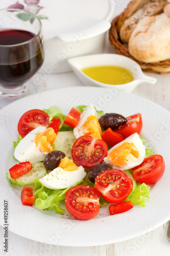 salad with boiled egg on the plate