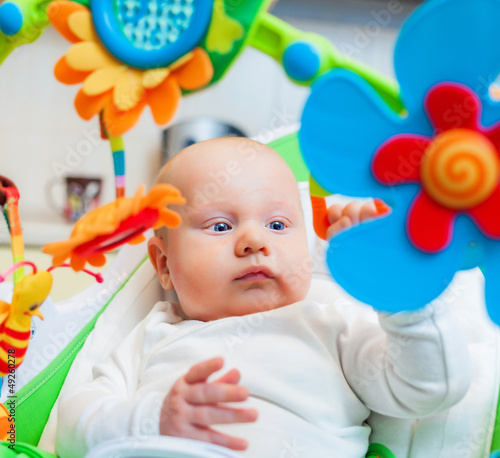 baby clutched colorful toy