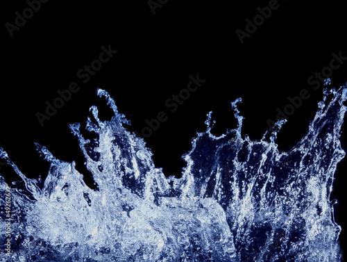 splashing water on black background photo