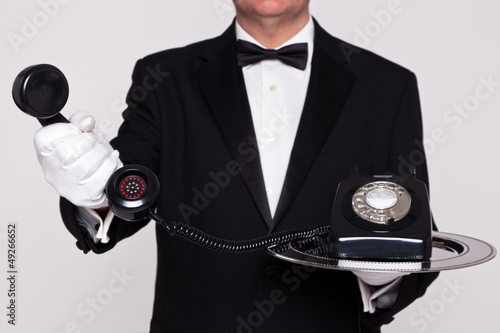 Butler handing you a telephone