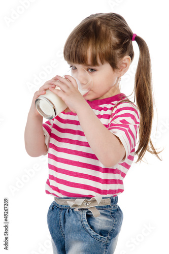 little girl drinking milk. isolated on white