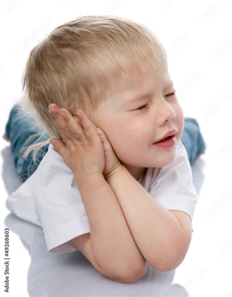 boy sleeping with hands under face. isolated on white boy sleeping with hands under face. isolated on white