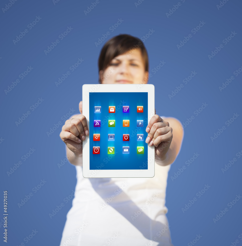 Young woman looking at modern tablet with abstract lights and va Young woman looking at modern tablet with abstract lights and va