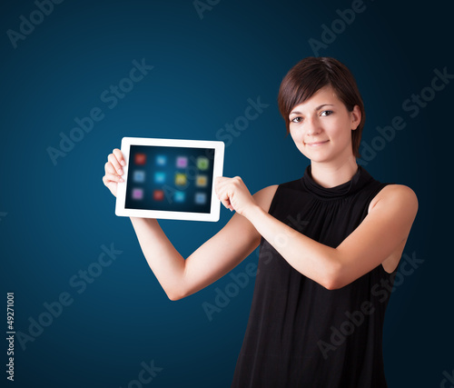 woman holding modern tablet with colorful icons