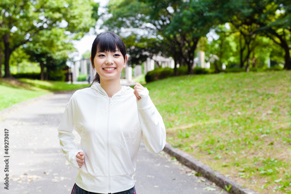 attractive asian woman jogging in the park attractive asian woman jogging in the park