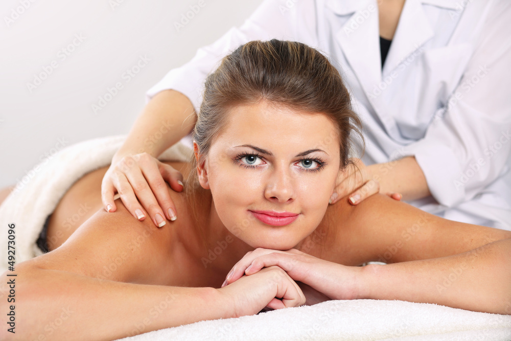 Closeup of an attractive young woman receiving massage Closeup of an attractive young woman receiving massage