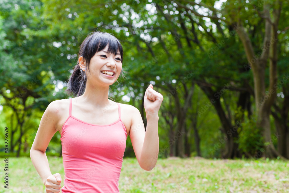 attractive asian woman jogging in the park attractive asian woman jogging in the park