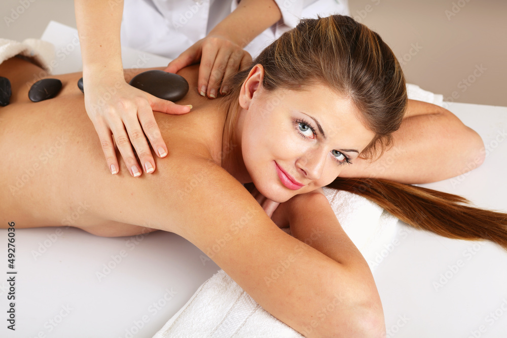 An attractive woman getting spa treatment, isolated on white An attractive woman getting spa treatment, isolated on white