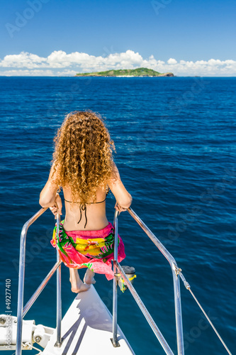 Young woman on a catamaran photo