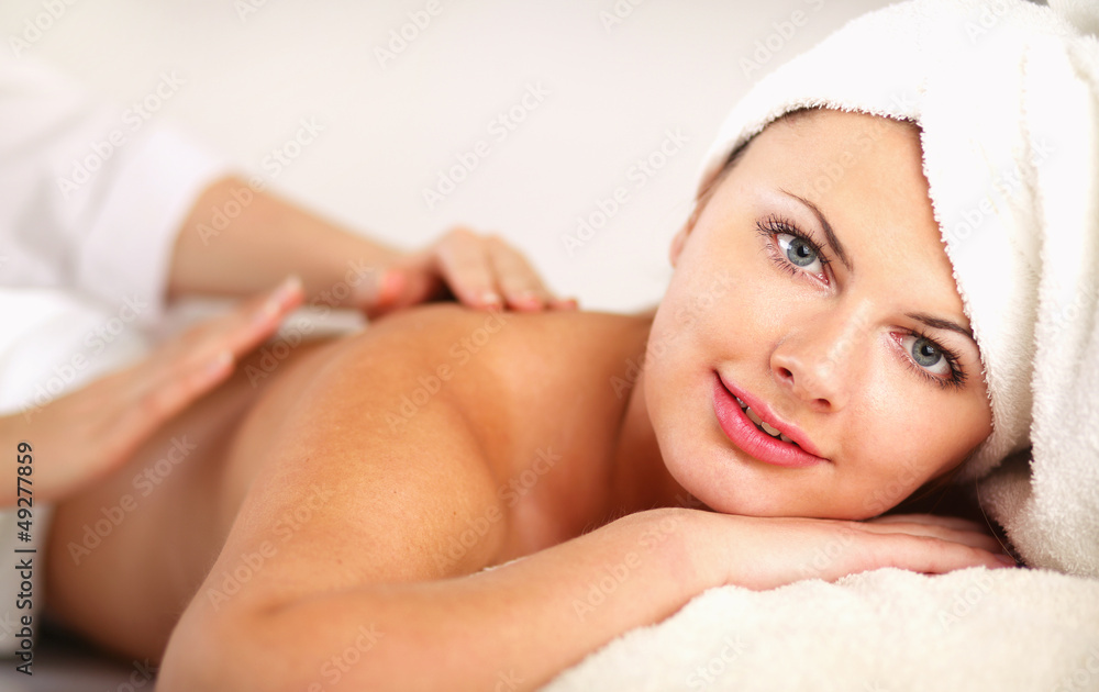 Closeup of an attractive young woman receiving massage Closeup of an attractive young woman receiving massage