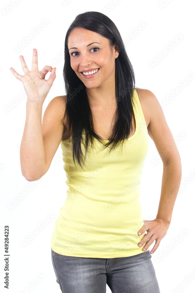 Happy young woman doing the ok sign