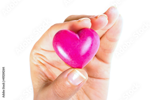 Heart in hand as love and health symbol