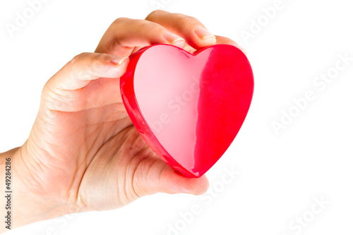 Heart in hand as love and health symbol