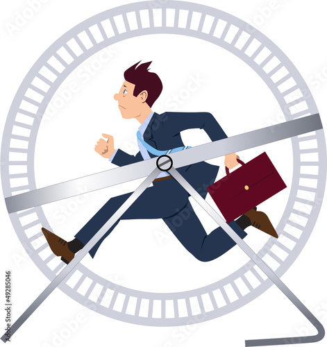 Businessman running in a hamster wheel