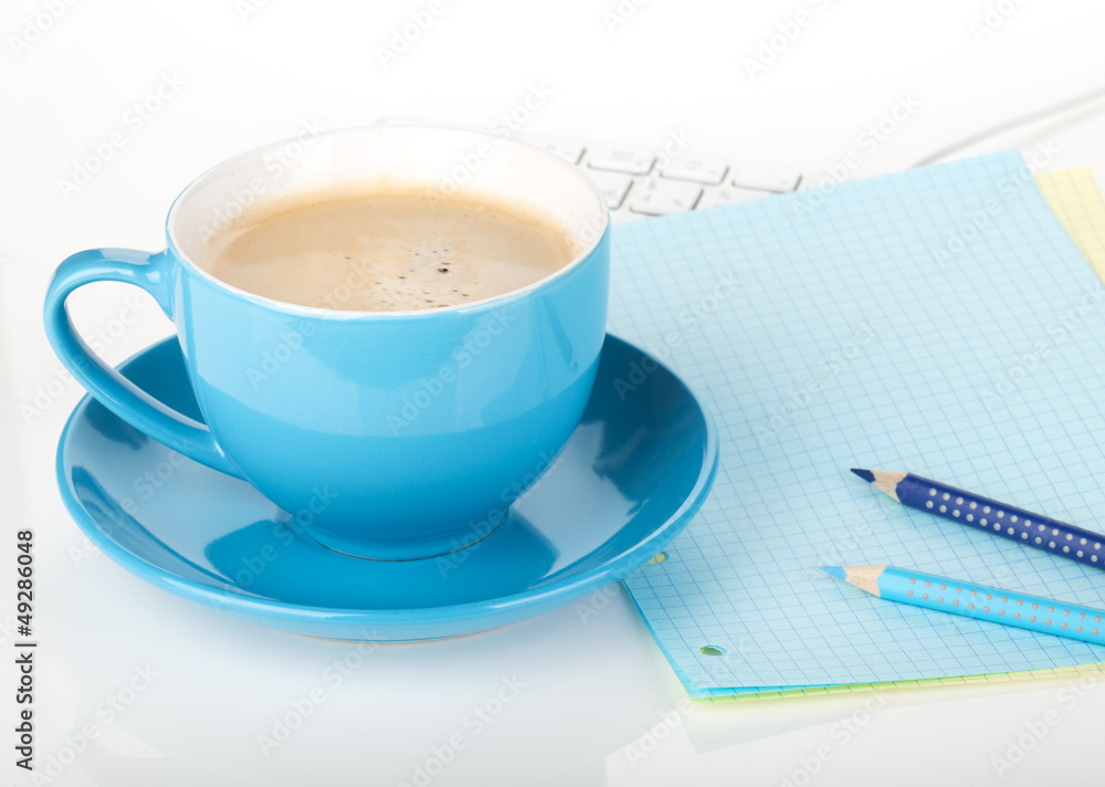 Blue coffee cup and office supplies Blue coffee cup and office supplies