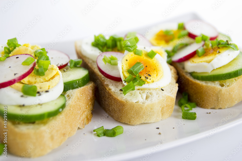 fresh sandwiches with eggs, radish, cucumber and chives fresh sandwiches with eggs, radish, cucumber and chives