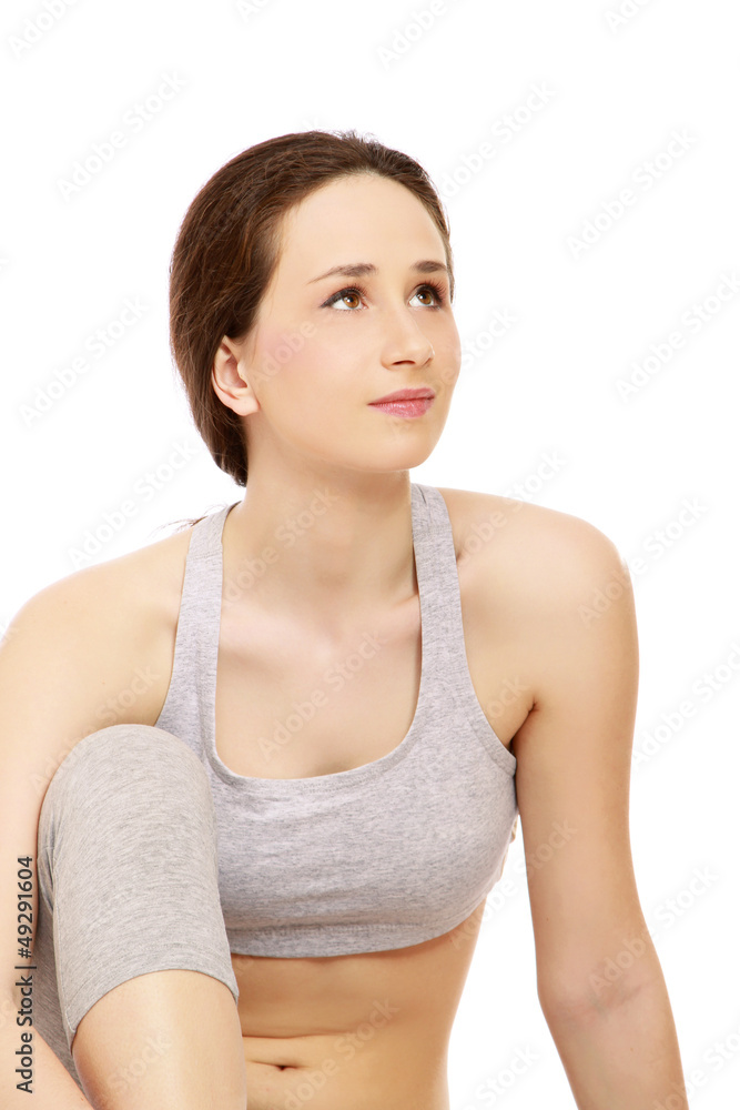 Attractive young woman in white underwear sitting Attractive young woman in white underwear sitting
