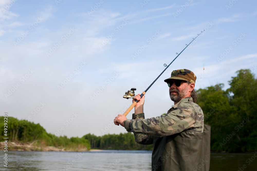 Fisherman makes casting tackle Fisherman makes casting tackle