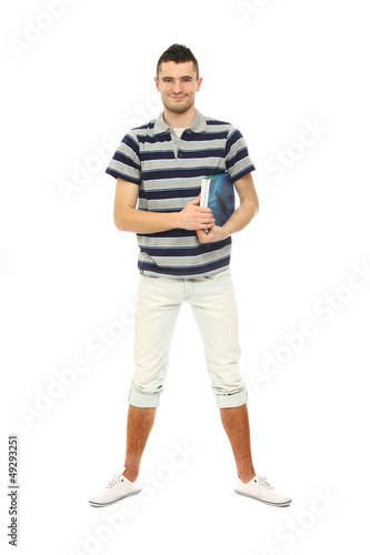 A full-length portrait of a young guy with books