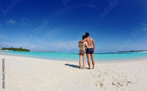 asian couple enjoying summer on beach