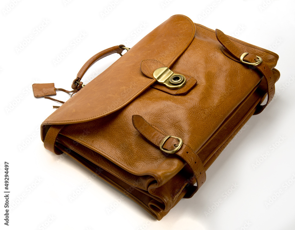 Old battered, leather briefcase on white background Old battered, leather briefcase on white background