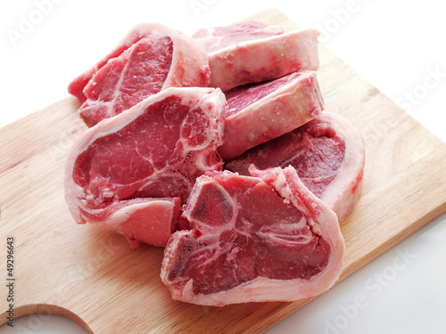 Lamb Loin Chops On Wooden Carving Board