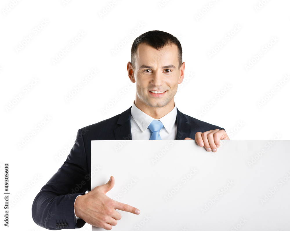 Business man points with hand at paper copyspace Business man points with hand at paper copyspace
