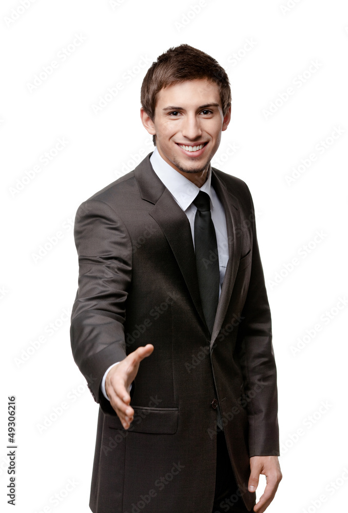 Friendly man giving hand for a handshake to seal the agreement Friendly man giving hand for a handshake to seal the agreement