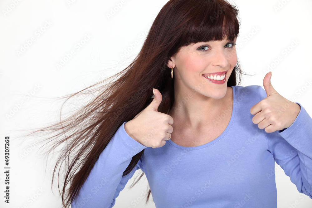 Attractive woman giving two thumbs up Attractive woman giving two thumbs up