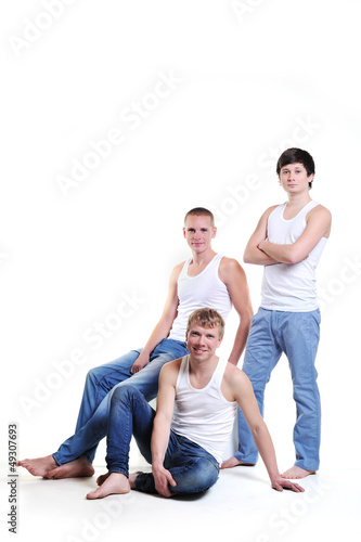Portrait of three men in white shirts