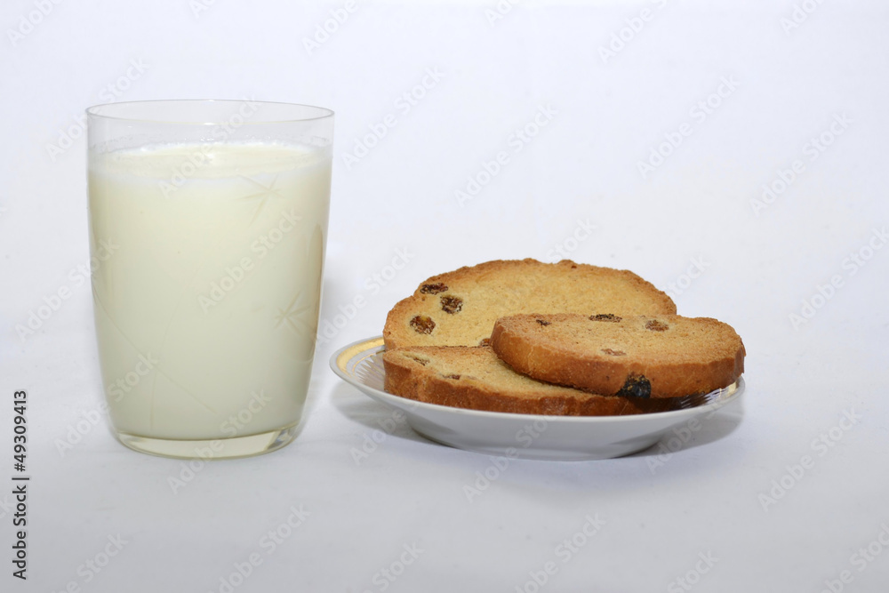 biscuits with raisins and milk on a white background biscuits with raisins and milk on a white background