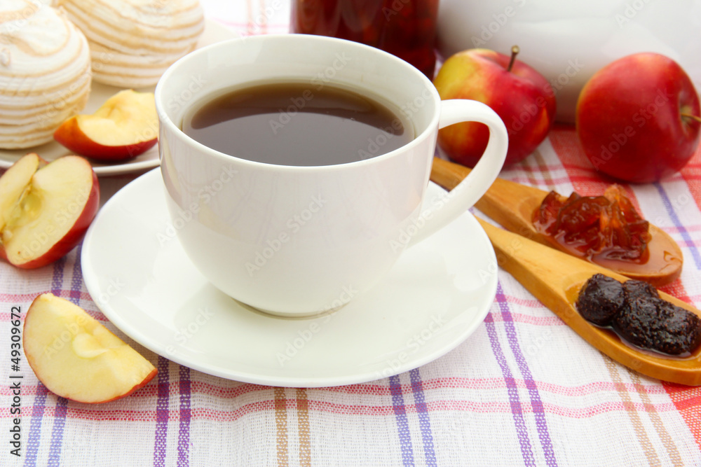 light breakfast with tea and homemade jam, on tablecloth light breakfast with tea and homemade jam, on tablecloth