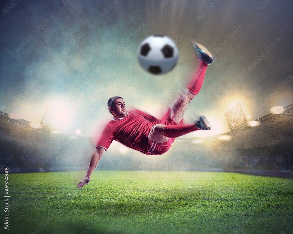 football player striking the ball football player striking the ball