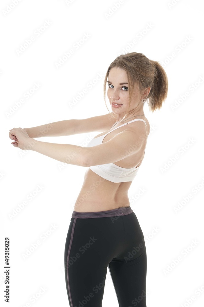 Beautiful happy athletic does exercises for the waist. Beautiful happy athletic does exercises for the waist.