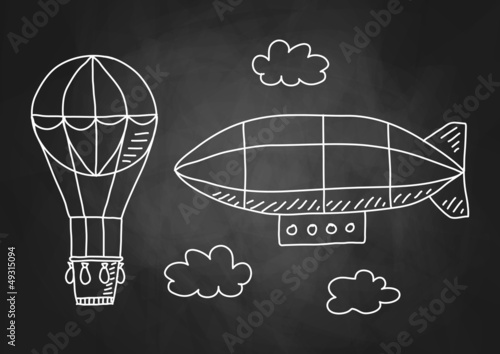 Hot air balloon and airship on blackboard