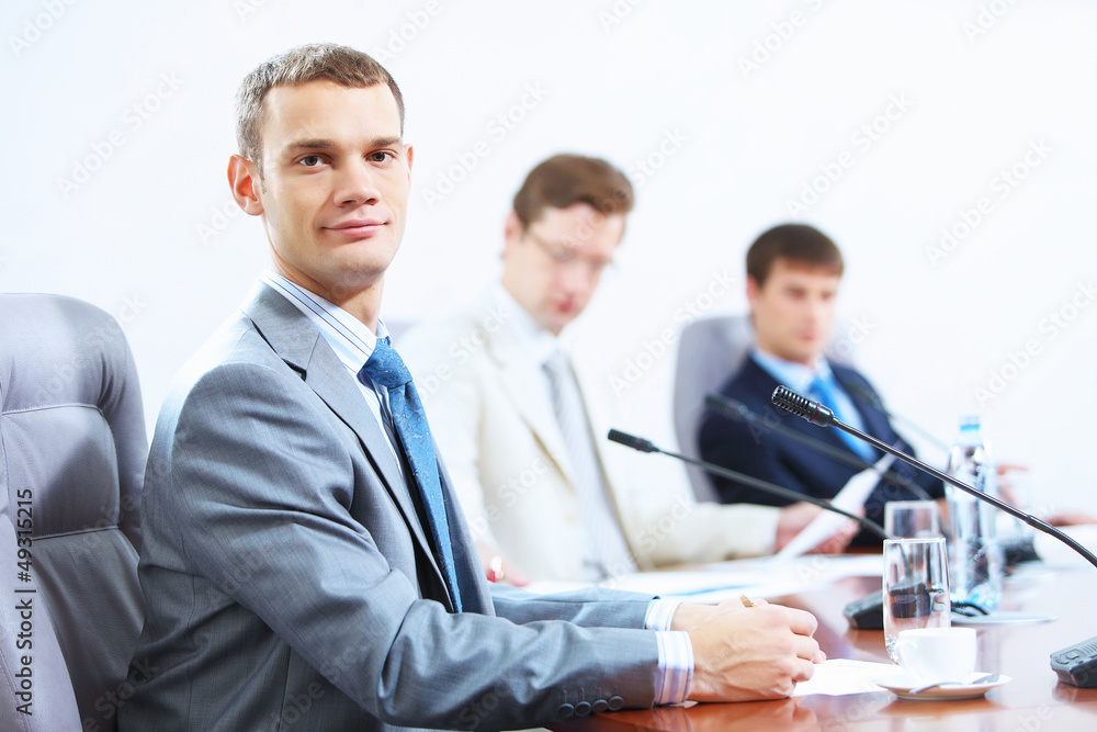 Three businesspeople at meeting Three businesspeople at meeting