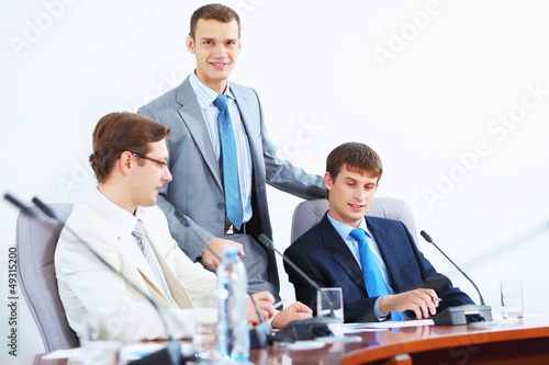 Three businesspeople at meeting
