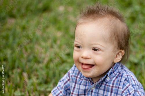 Down Syndrome child laughing and smiling