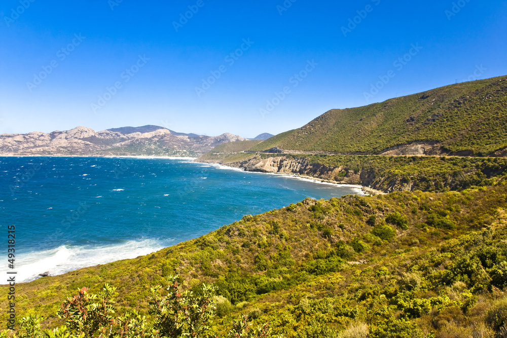 Crystal clean sea along white sand beach in island Corsica Crystal clean sea along white sand beach in island Corsica
