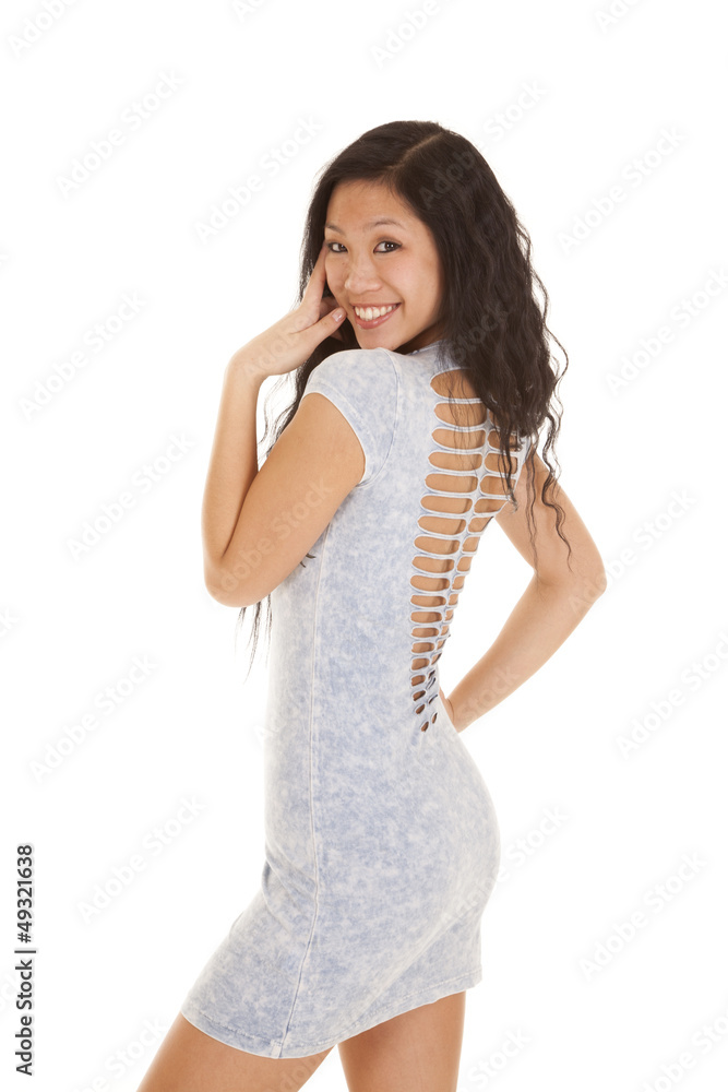 Asian woman blue dress back smile Asian woman blue dress back smile