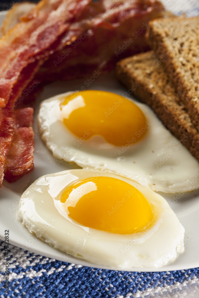 Organic Sunnyside up Egg with toast and bacon Organic Sunnyside up Egg with toast and bacon
