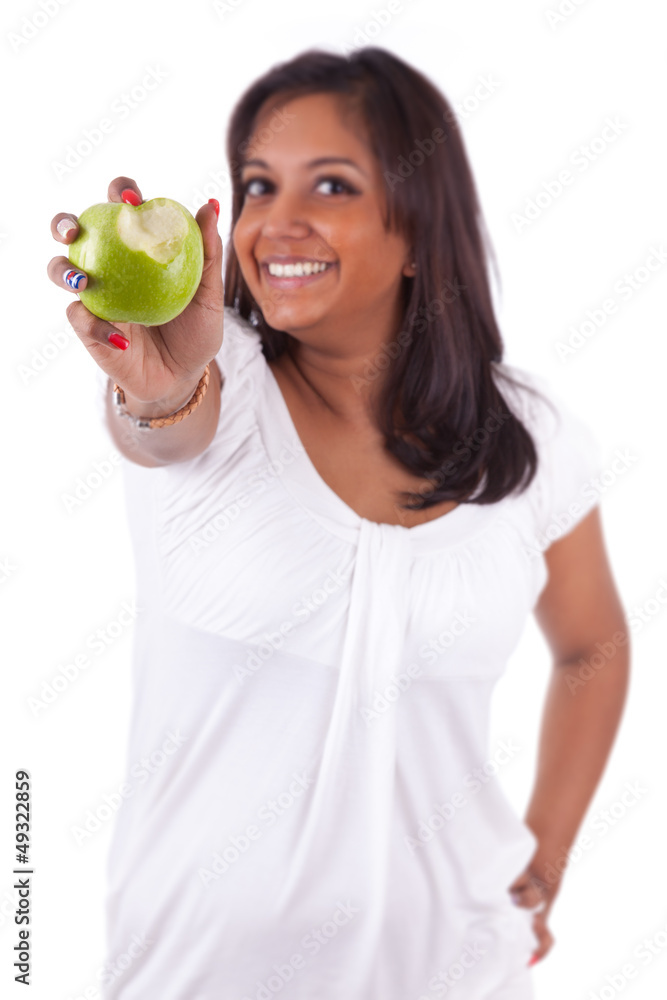 Young indian woman eating an apple Young indian woman eating an apple
