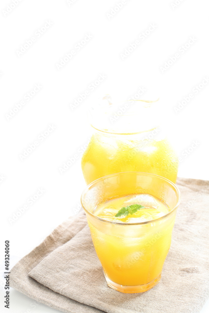 orange jucie with ice cube for summer drink image