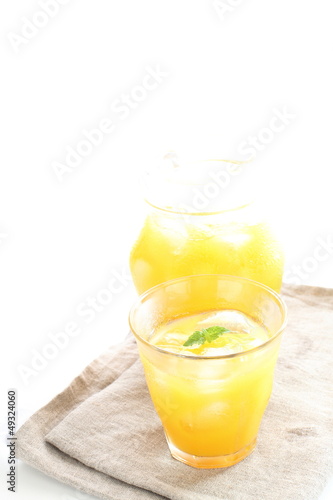 orange jucie with ice cube for summer drink image