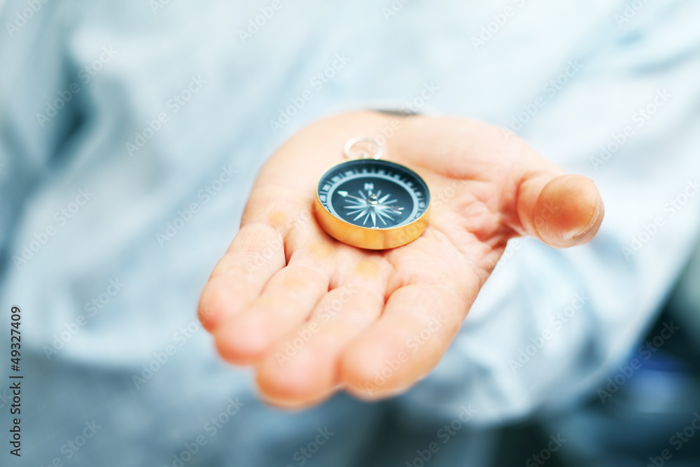 Image of compass in businessman hand