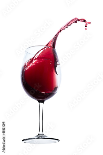 red wine splashing out of a glass, isolated on white