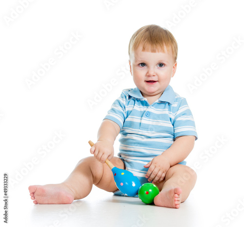 Baby  boy playing with musi...