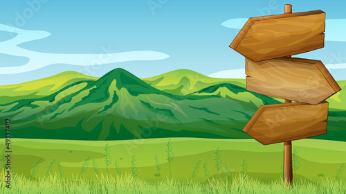 Empty wooden signboard across the mountains