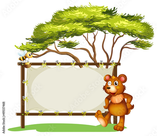 A notice board, a bear and a honey bee